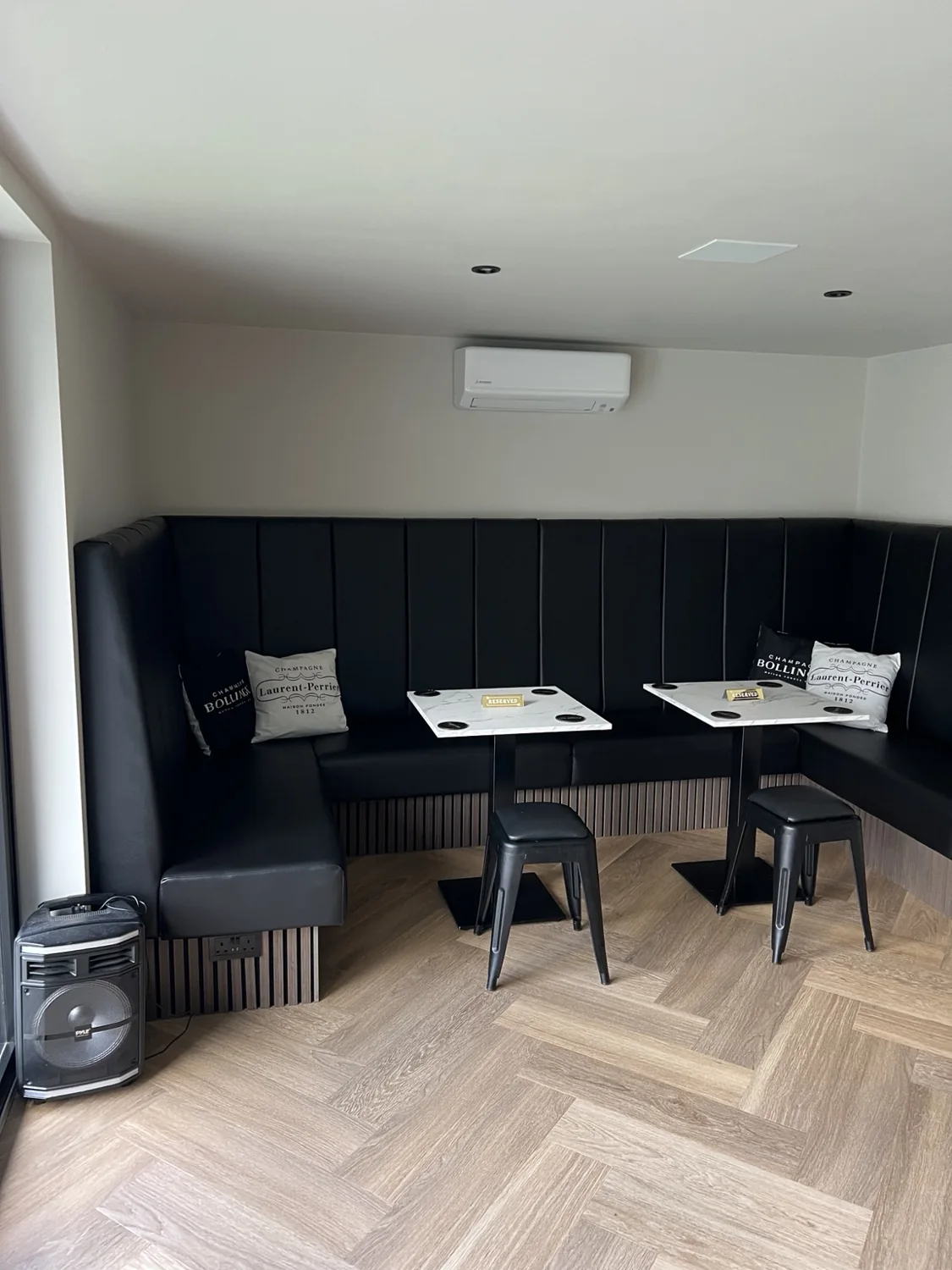 Bespoke corner seating with two tables